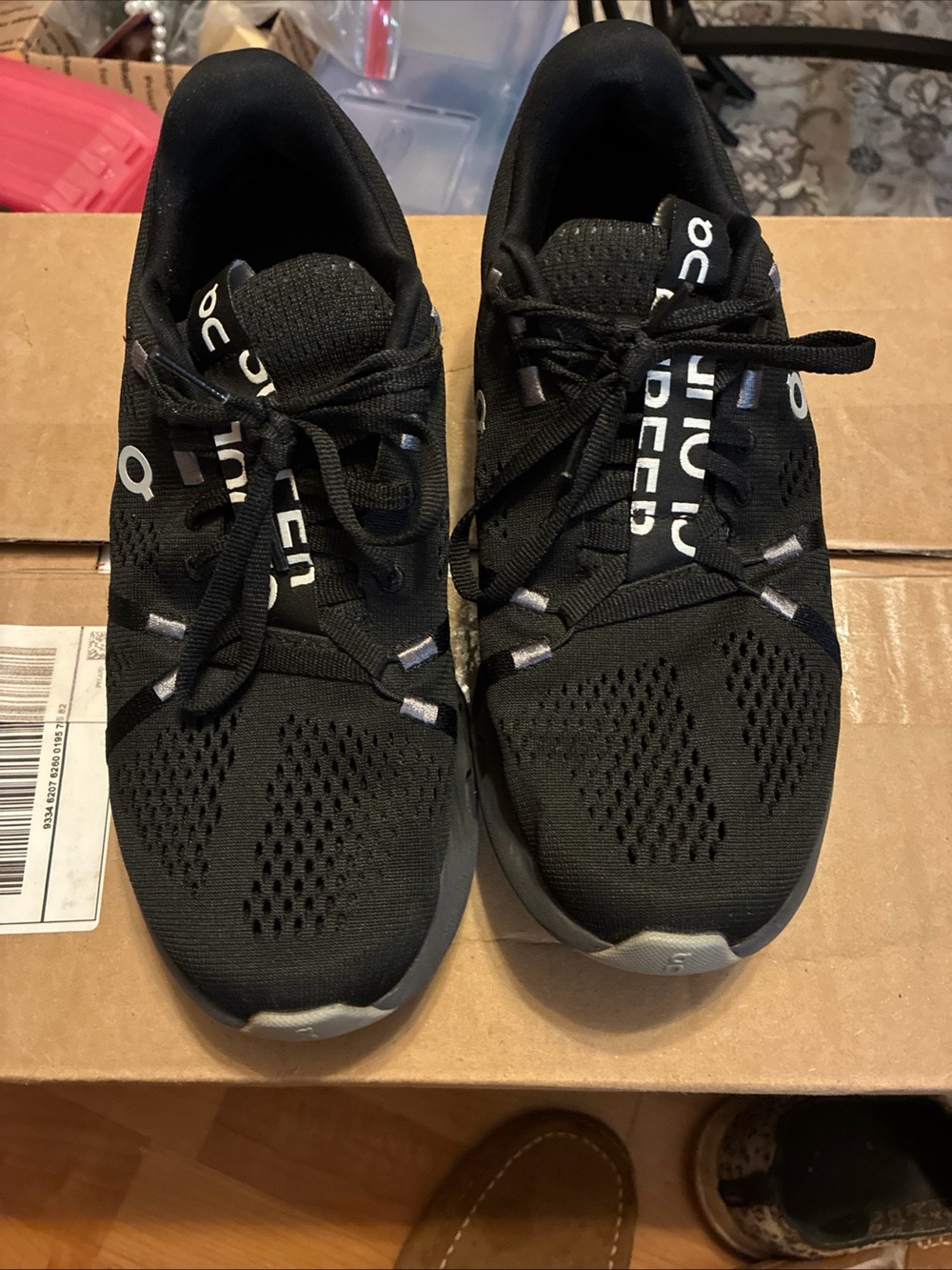 On Running Black Athletic Shoes with Gray Accents